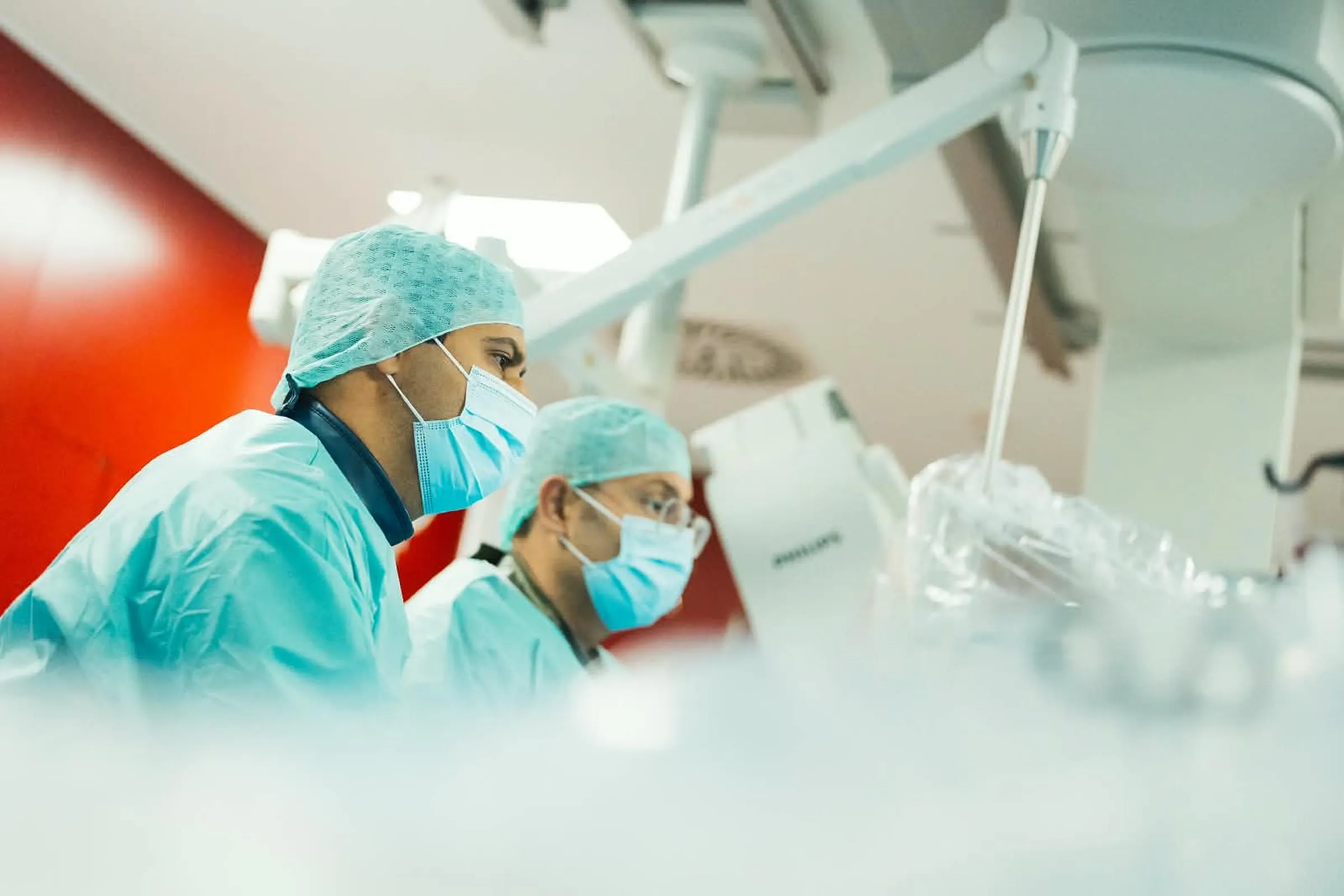 Specialists performing a catheter ablation in the electrophysiology lab